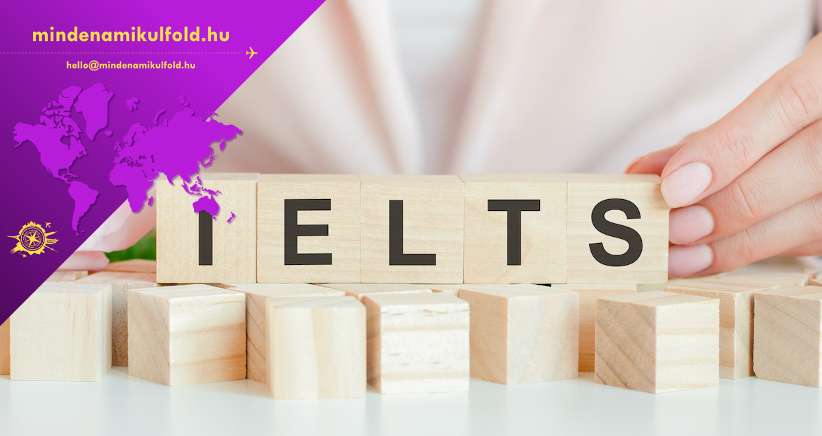 ielts text on wooden block in hand, concept